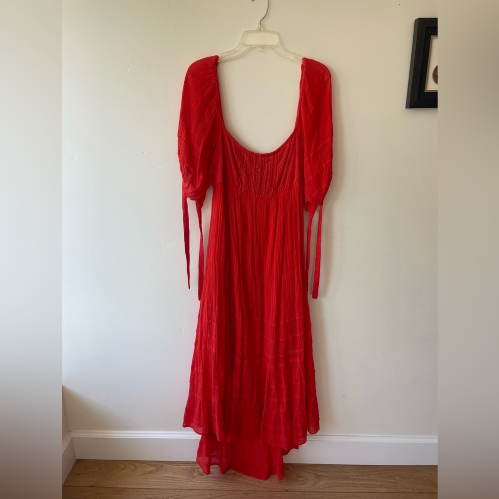 Free People puff sleeved open back dress. Size M